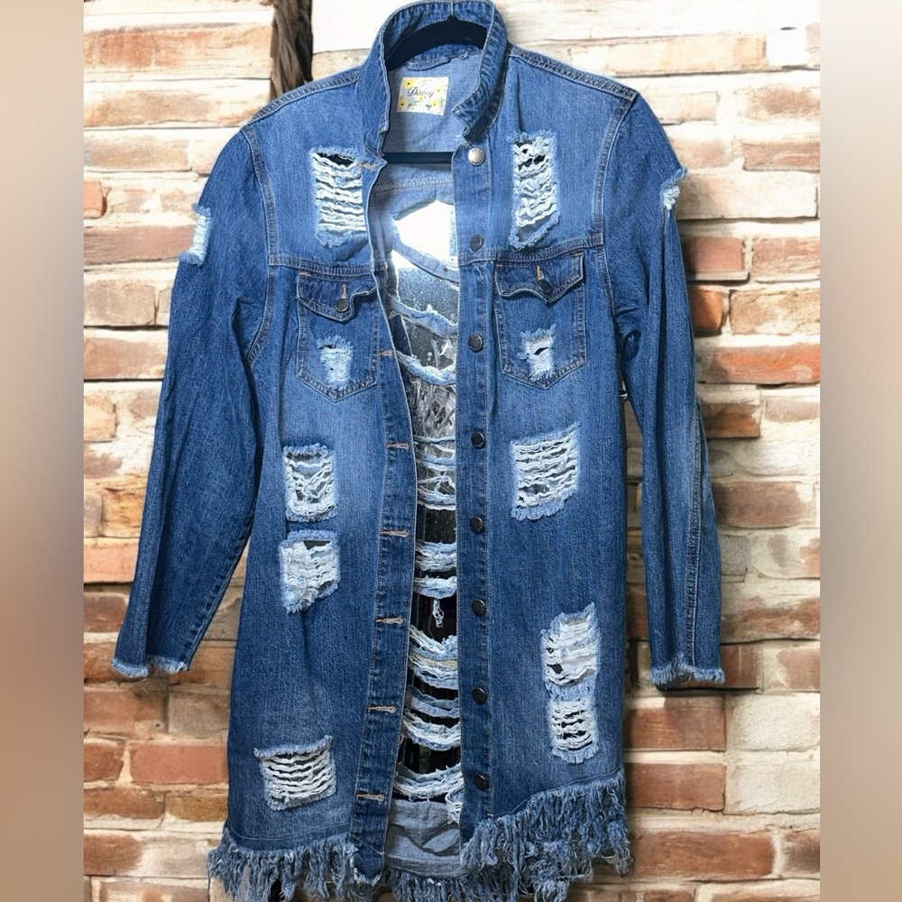 Edgy distressed denim jacket with rips, and fringed hem.  Perfect for layering!